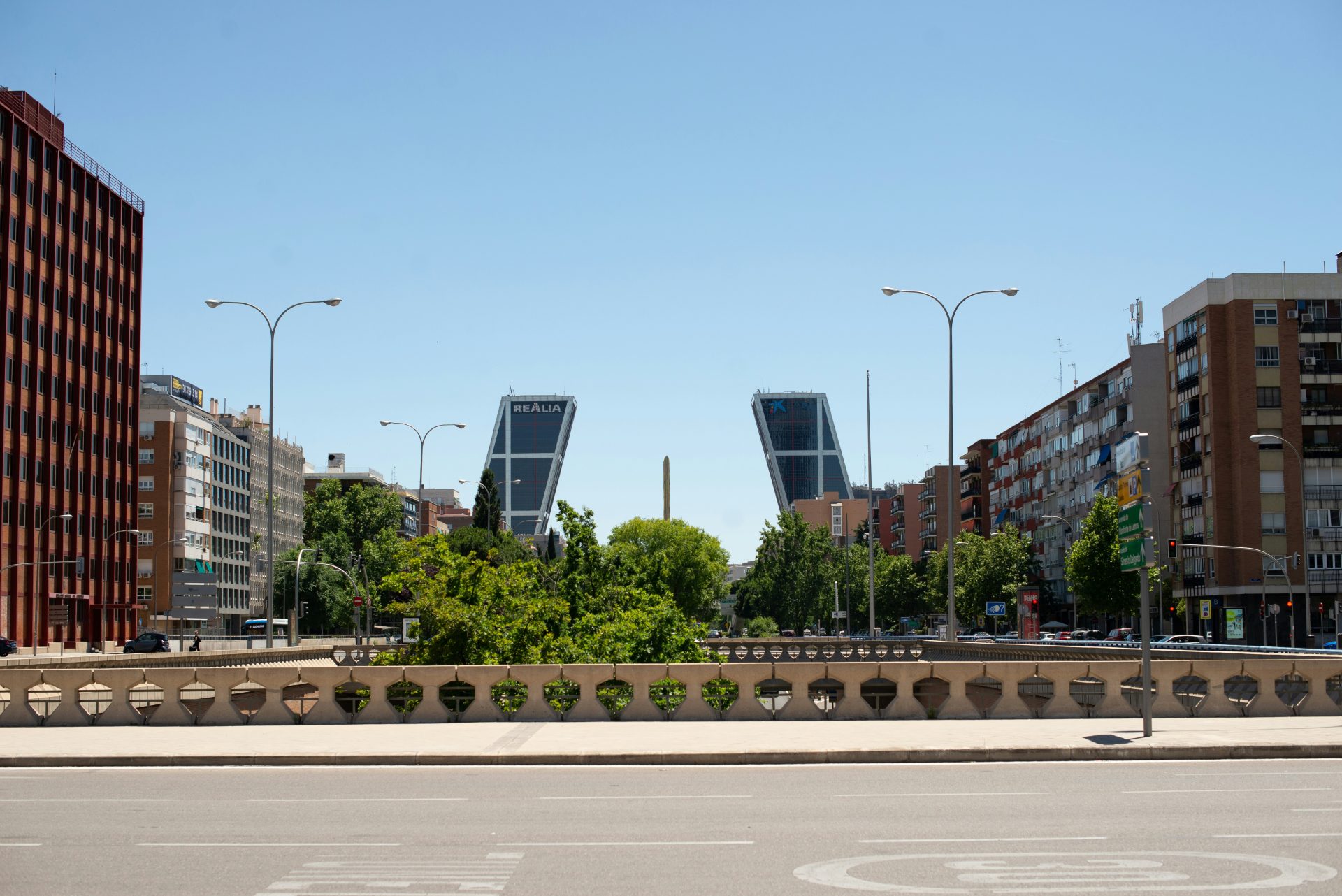 A city street with tall buildings in the background