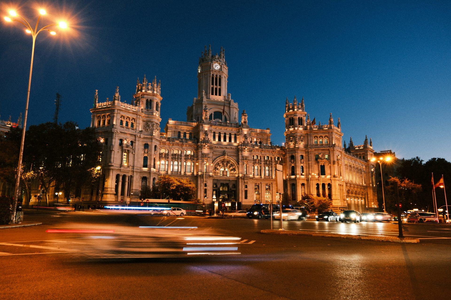 A large building with a clock tower at night